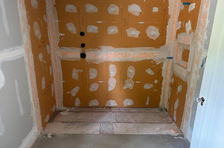 Shower framed with orange foam backer board before tiling