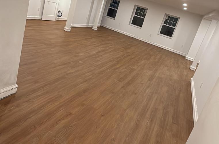 Finished warm wood flooring installed by Silcam Tile