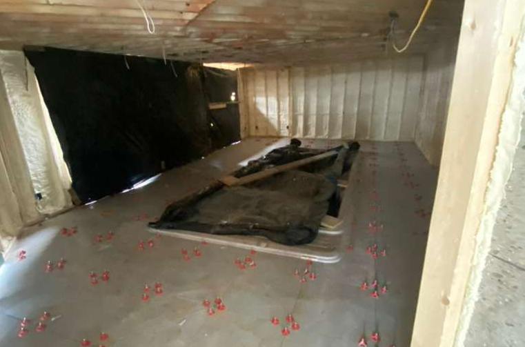 Spa room during demolition with the tub opening framed out