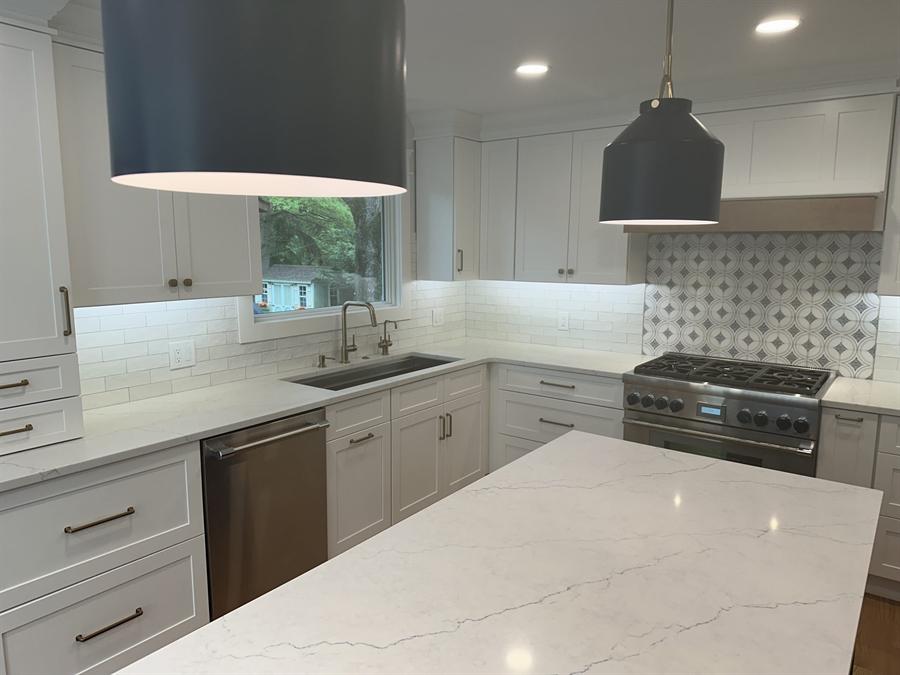 Kitchen with mosaic backsplash and waterfall stone countertop, New Jersey