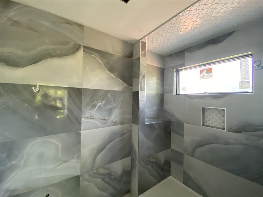 Large-format onyx-look tile bathroom walls, New Jersey