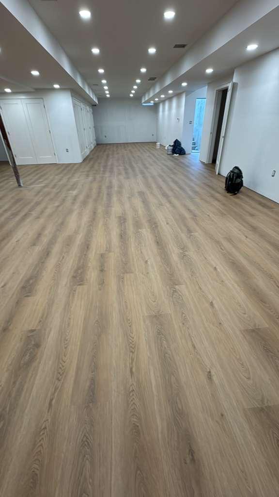 Luxury vinyl plank flooring installed by Silcam Tile Installation in a New Jersey hallway